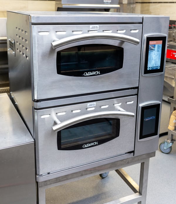 close up of a stainless steel oven in a commercial kitchen