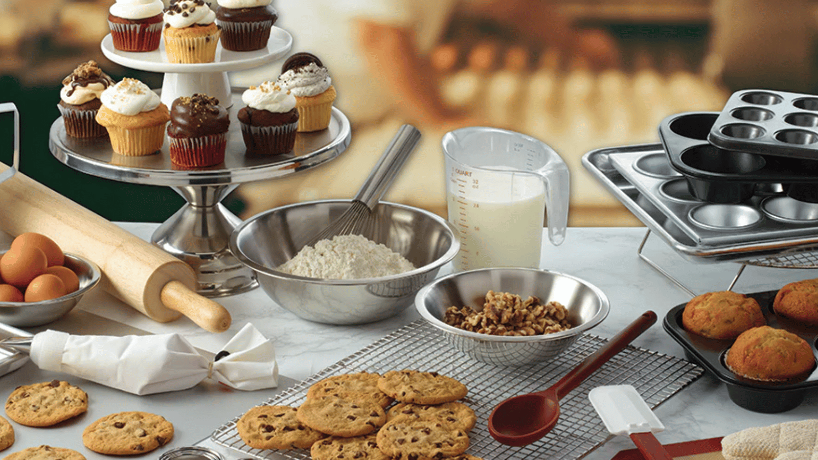 Winco baking equipment with cookies on cooling racks, milk in measure cup and flour in bowl.