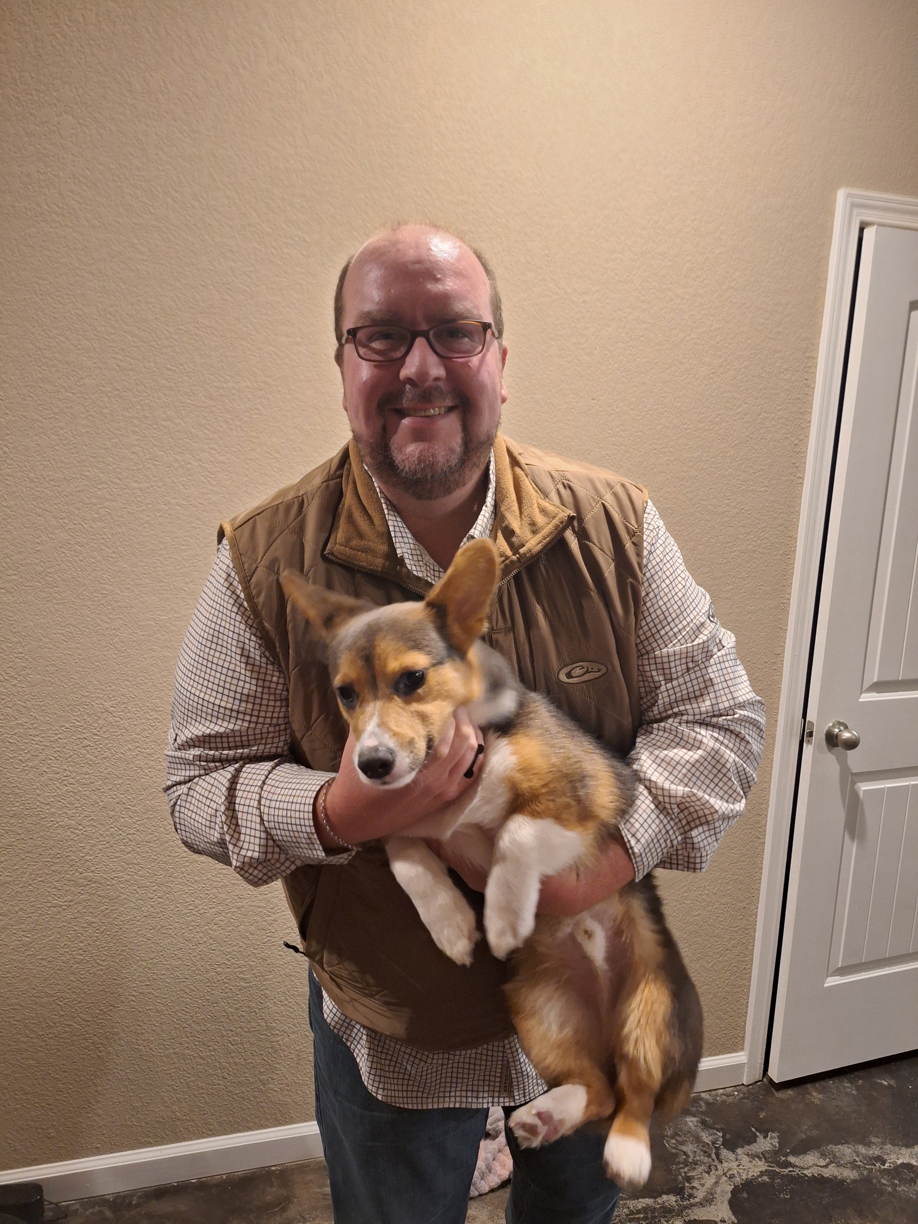man holding a dog